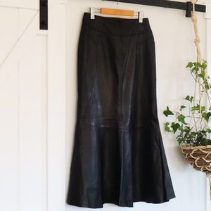 Black leather mermaid fit and flair maxi skirt by Daniel. Size 8.